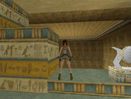 Stand at the edge of the opening and carefully adjust Lara's position so she's squarely facing the near right corner of the column. (Don't forget to use the Look button to make sure the path she'll travel is straight.) Then hop back once, so she's in the position shown above.