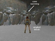 Note the opening in the wall above the angled block. The ledge is a little too high to grab, so use the block to give Lara a boost.