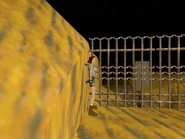 Egypt19.jpg (97 KB) Go to the long fence through which you can see the pool beyond. Position Lara in the left corner (where one of the boxes of shotgun shells was) with her left hand against the fence and the yellow sandy hill behind her. Back up until Lara's back touches the sandy rock (as shown above).