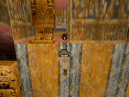 Pull up into the alcove above. The door behind the statue opens automatically. This is secret #1.