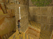 Turn to face the wall near the entrance and adjust Lara's position as needed. Use the corner bug to get to the ledge above.