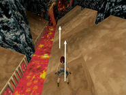 Take another standing jump forward to the next flat spot. Now take a running jump to the next. Be sure to set up this jump by walking forward to the little "lip" where the next floor tile juts up a bit. Then hop back before taking the running jump. Otherwise, Lara can stub her toe on that jutting floor tile and do a standing jump instead of a full running jump and end up in the lava.