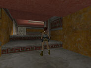 At the top of the stairs is a switch that stops the swinging blades. You can ignore it, since you won't be going back that way.