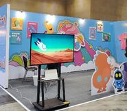 An early convention to introduce the Larva In Mars series. (Notice that early test animation footage was shown on the TV)
