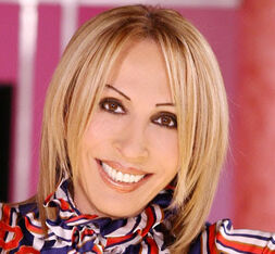 Peruvian television host Laura Bozzo, whose Laura show is a hit on the  U.S. Spanish network Telemundo, shows her passport during a news conference  in Lima, Peru, Wednesday, April 2, 2003. Bozzo