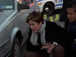 Benson examines a sideswiped car