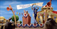 Sportacus tries to grab ahold of the banner in an attempt to save himself.