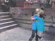 John and Misty hug in victory