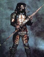 Predator7.jpg (9 KB) Predator wielding his staff double edged speared weapon the Combi Stick.