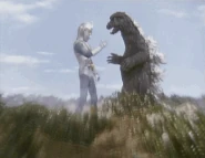 Zone Fighter and Godzilla shaking hands
