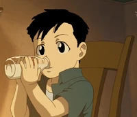 Robby drinks his milk from the bottle.