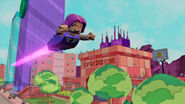 Starfire flying past Jump City High School