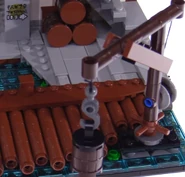 70657 Kran.png (894 KB) Der Kran hält bereits ein Fass, im Hintergrund die anderen drei in ihrem Stauraum