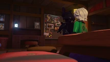 Garmadon betrachtet die Fotos der Ninja.