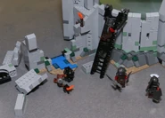 The deeping wall destroyed and the Uruk-Hai climbing ladders into Helm's Deep