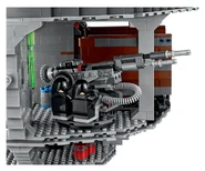 Rotating turbolaser turret with two spring-loaded missiles. Two spare missiles are mounted on the wall.