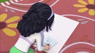Emma a égaré son croquis mais s'en souvient et explique son idée à Tanya.