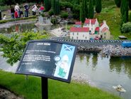 Loch Ness plaque and fishing village in background