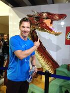 Benedict Cumberbatch with the life size LEGO Smaug at San Diego Comic Con.