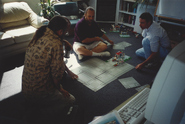 Various LEGO Island developers working on a LEGO Island layout during the meeting