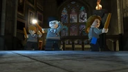 Harry, Ron and Hermione roam Hogwarts at night.