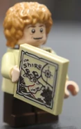 Bilbo with a map of the Shire