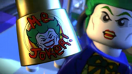 The Joker with Bruce Wayne's "Man of the Year" award