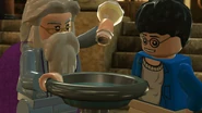 Professor Dumbledore pouring a memory of Tom Riddle into the Pensieve