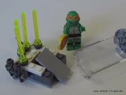 Michelangelo escaping the Kraang's laser prison