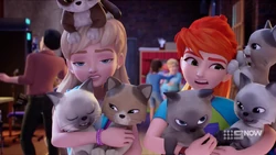The cat keeps pulling Mia’s hair!