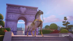Barney standing in front of the Welcome Arch.