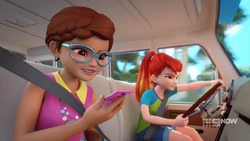 Mia driving while Olivia navigates.