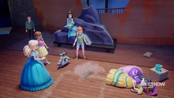 Emma tackled Andrea to avoid another falling sandbag.