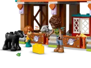 Aliya and Ben with a cow