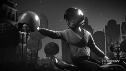 Ethan holding Emma’s helmet