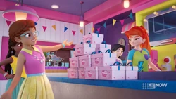 Olivia is happy with the stack of cupcake boxes.