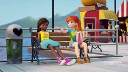 Mia trying to share her popcorn with Andrea.
