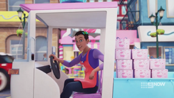 Dean driving the Cupcake Cafe delivery truck.