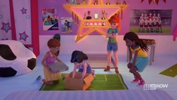 The girls are taking the console away so Stephanie can’t play the game anymore.