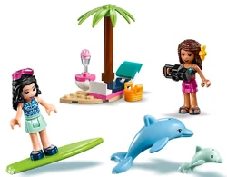 Emma surfing with the dolphins.