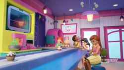 Andrea singing in the Cupcake Cafe.