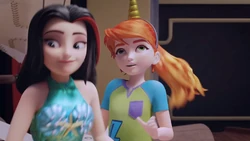 Vicky places the mermaid headband on Mia's head. Now they're even.