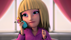 Tanya calling Zoey on her cupcake phone in Roomies.