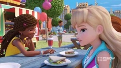 Andrea trying to snitch Olivia’s sandwich.