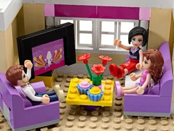 Olivia and her parents watching TV.