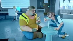 Ricky stacking marshmallows, watched by Joey and Sherlock.