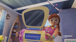 Olivia showing the girls her improved sonic device.