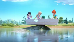 The girls are surprised to see the rowboat has hit a rock.