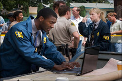 Hardison and Parker as Agents Leonard and Elmore