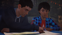 Sean and Daniel are looking at their map. ("Roads")